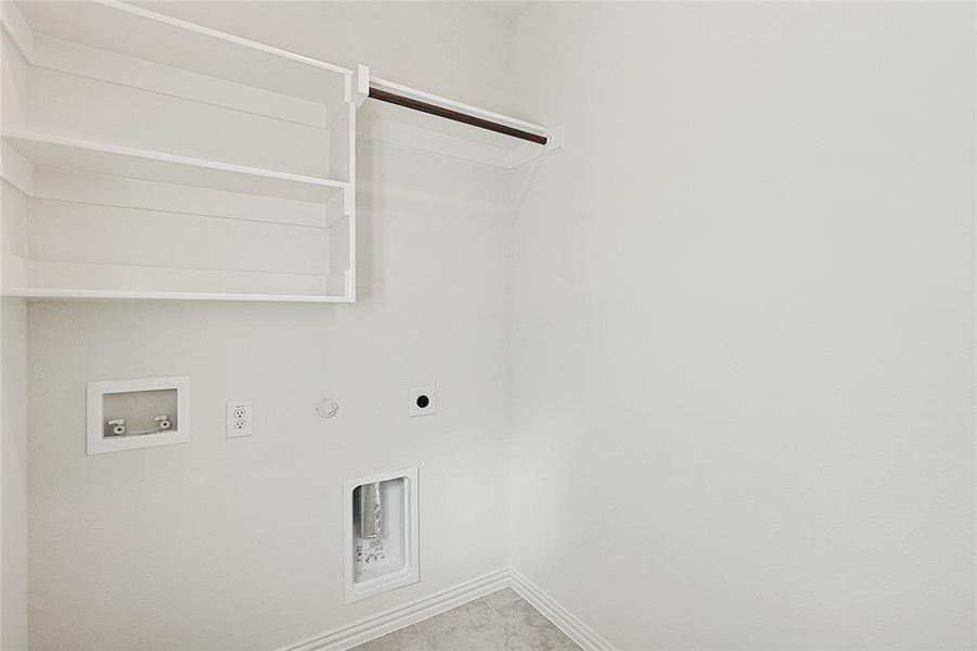 Laundry room featuring gas dryer hookup, hookup for a washing machine, and electric dryer hookup