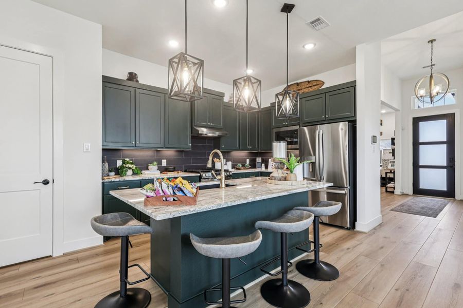 Representative furnished interior of a home built from the Oxford by Chesmar Homes in Sunterra, Katy (Image 3).