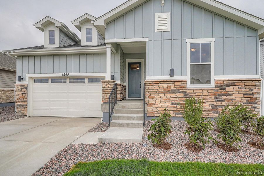 Front exterior of a new home in Hilltop 55+ at Inspiration 55s, Aurora, CO, highlighting curb appeal (Image 19).