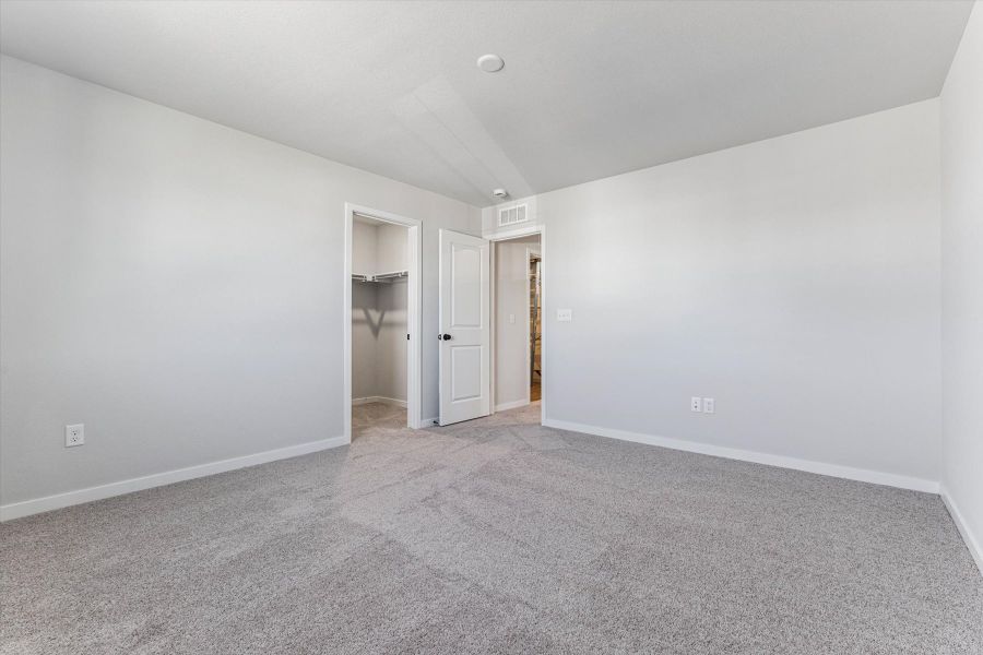 A hallway with white walls.