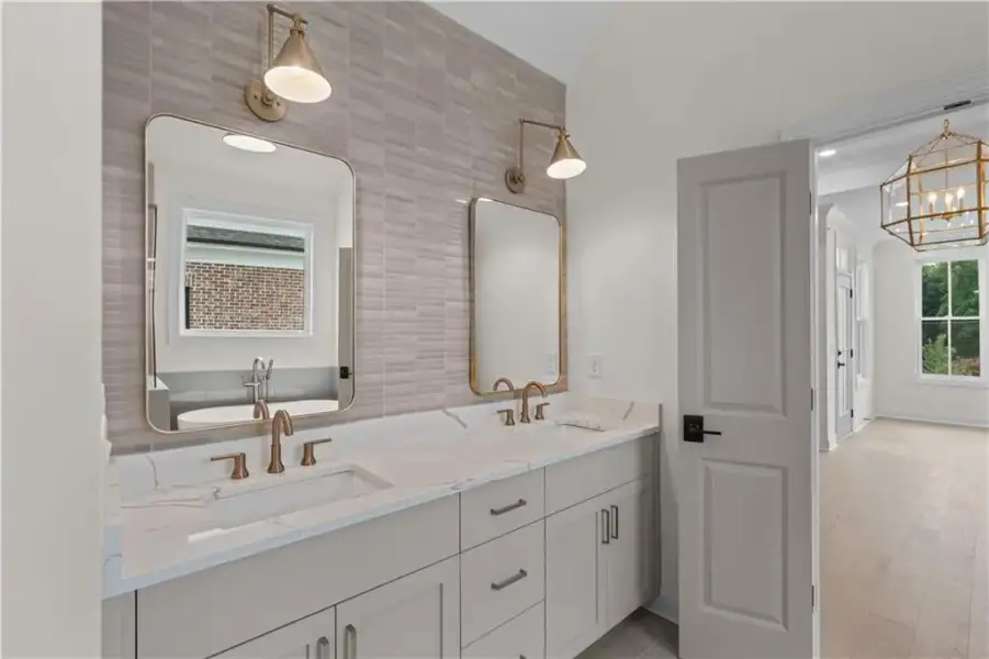 THE OWNERS ENSUITE IS ELEGANT AND RELAXING