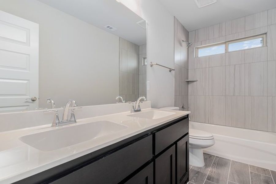 Furnished interior view inside a new home in Mustang Place II, Heartland (Image 11).