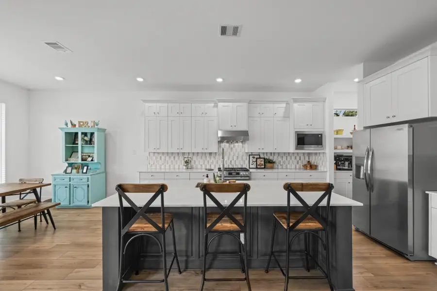 Furnished interior view inside a new home in The Highlands: Pinnacle Collection, Porter Heights (Image 9).