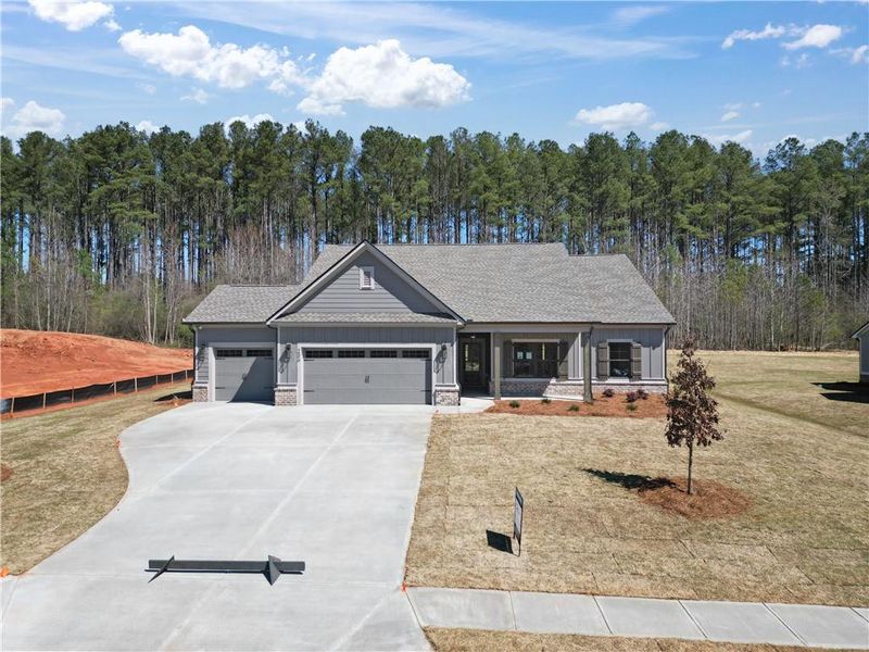 Front exterior of a new home in Weslyn Park, Social Circle, GA, highlighting curb appeal (Image 2). Front exterior of a new home in Weslyn Park, Social Circle, GA, highlighting curb appeal (Image 2).