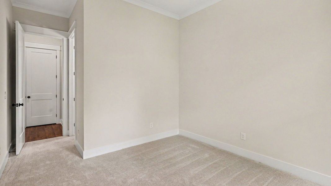 Secondary bedroom with carpet and closet Secondary bedroom with carpet and closet