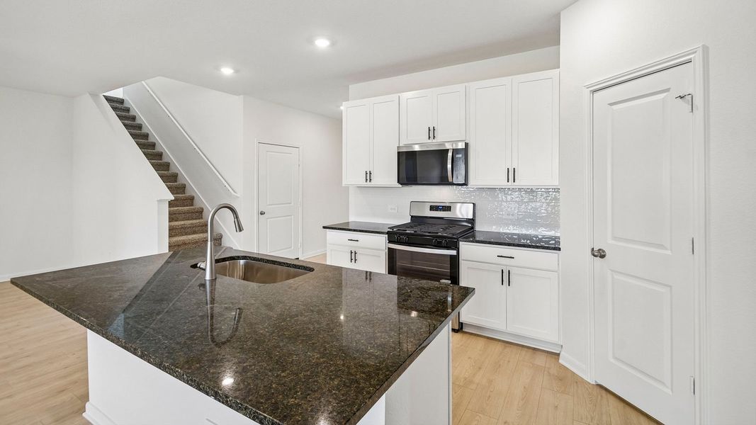 Furnished interior view inside a new home in Revelry, Del Valle (Image 8).