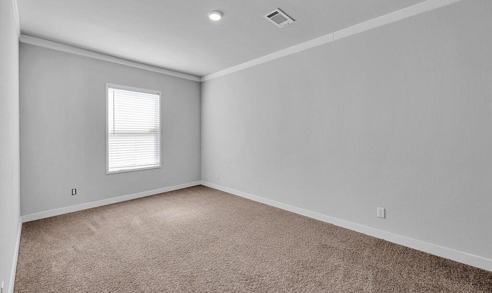 Empty room with light carpet and ornamental molding Empty room with light carpet and ornamental molding
