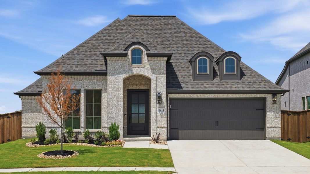 Front exterior of a new home in Devonshire, Forney, TX, highlighting curb appeal (Image 1). Front exterior of a new home in Devonshire, Forney, TX, highlighting curb appeal (Image 1).