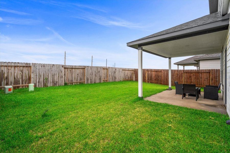 Exterior details and patio area of a home in Bluestem, Brookshire (Image 3). Exterior details and patio area of a home in Bluestem, Brookshire (Image 3).