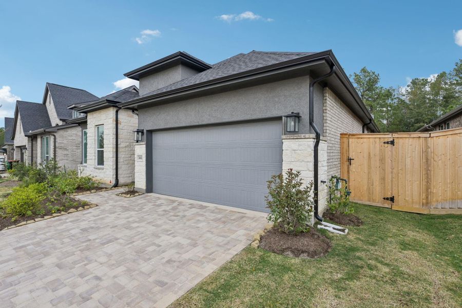 Front exterior of a new home in Kresston, Montgomery, TX, highlighting curb appeal (Image 23). Front exterior of a new home in Kresston, Montgomery, TX, highlighting curb appeal (Image 23).