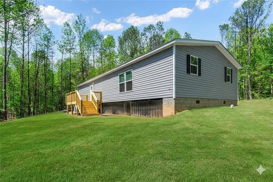 Exterior details and patio area of a home in , Ellijay (Image 25).