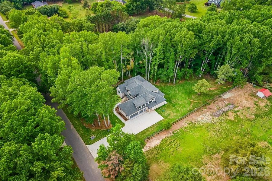 Front exterior of a new home in , Waxhaw, NC, highlighting curb appeal (Image 26).
