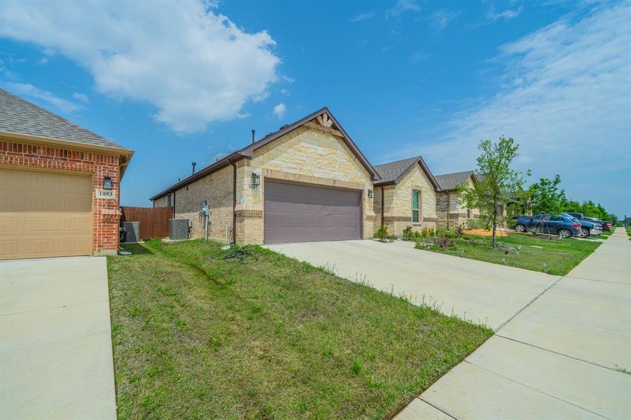 Front exterior of a new home in , Alvarado, TX, highlighting curb appeal (Image 20).