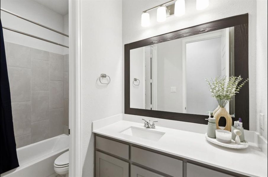 Full bath with vanity and shower / bath combo with shower curtain