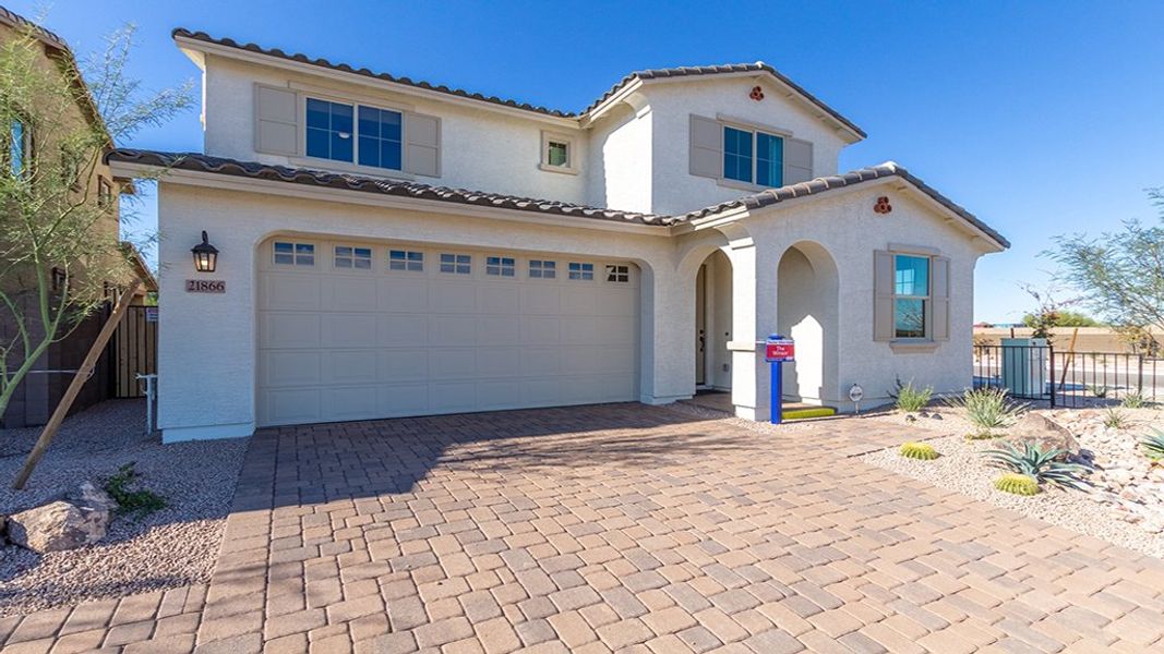 Representative exterior photo of a completed home built from the Winsor by Taylor Morrison in Paradisi Discovery Collection, Surprise, AZ (Image 21).
