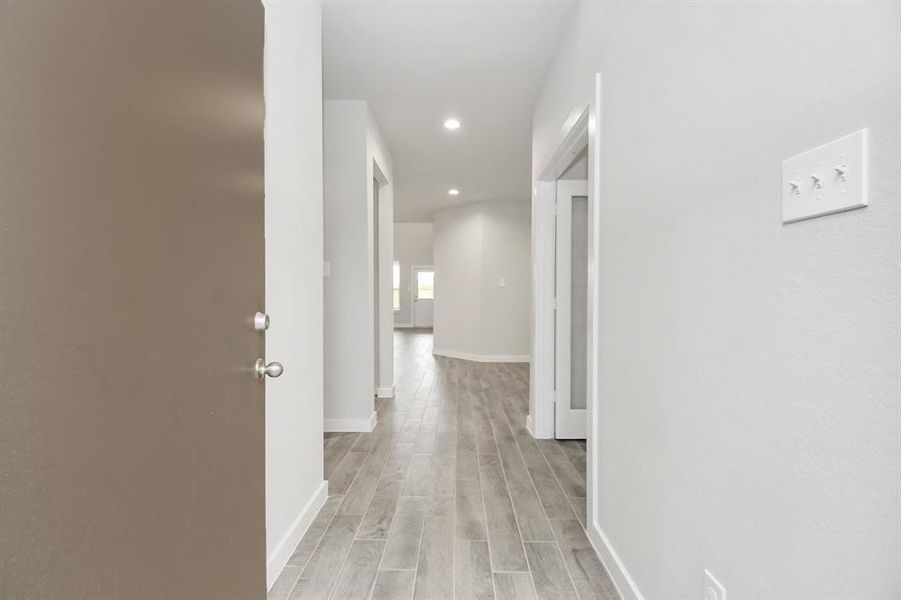 As you step into the threshold of this luxurious home, you'll soon be welcomed by an elegant glass door (to be installed). Inside, soaring ceilings amplify the spaciousness, while the refined wood-look tile flooring and oversized baseboards exude sophistication and charm.