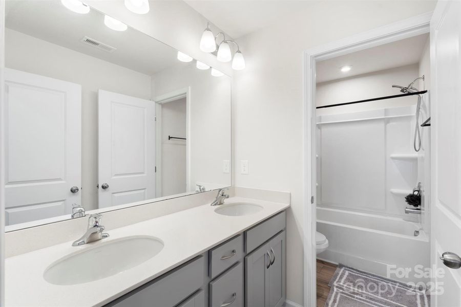 Furnished interior view inside a new home in Waxhaw Landing, Monroe (Image 13).