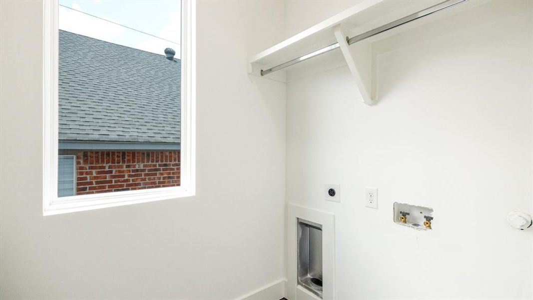 Laundry room featuring hookup for a washing machine and electric dryer hookup