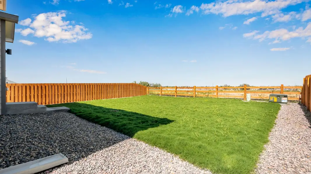 Exterior details and patio area of a home in Vista Meadows, Fort Lupton (Image 19).