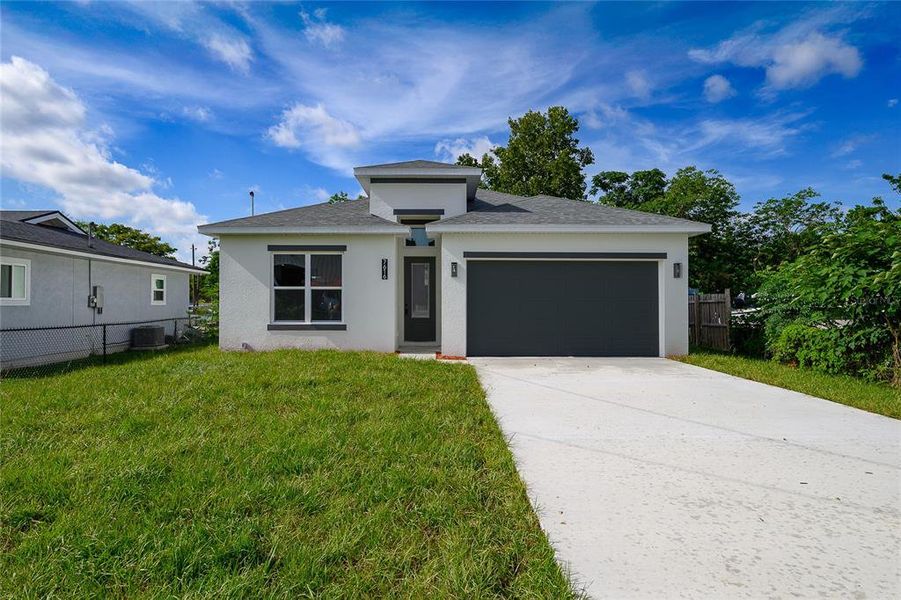 Front exterior of a new home in , Orlando, FL, highlighting curb appeal (Image 1).