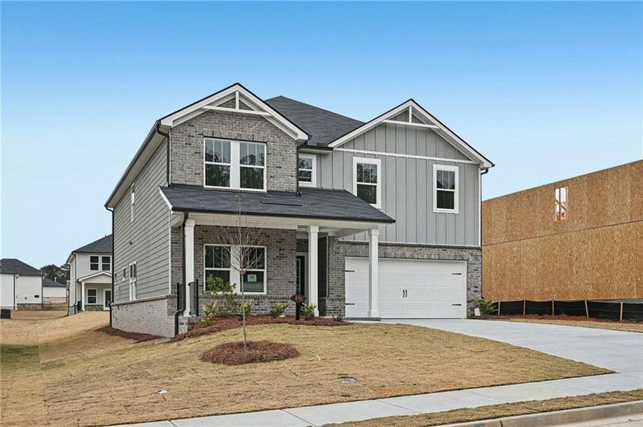 Front exterior of a new home in Parkside at Grayson, Grayson, GA, highlighting curb appeal (Image 2). Front exterior of a new home in Parkside at Grayson, Grayson, GA, highlighting curb appeal (Image 2).