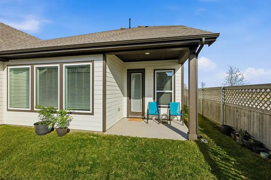 Exterior details and patio area of a home in Pecan Square - Gardens, Northlake (Image 4). Exterior details and patio area of a home in Pecan Square - Gardens, Northlake (Image 4).