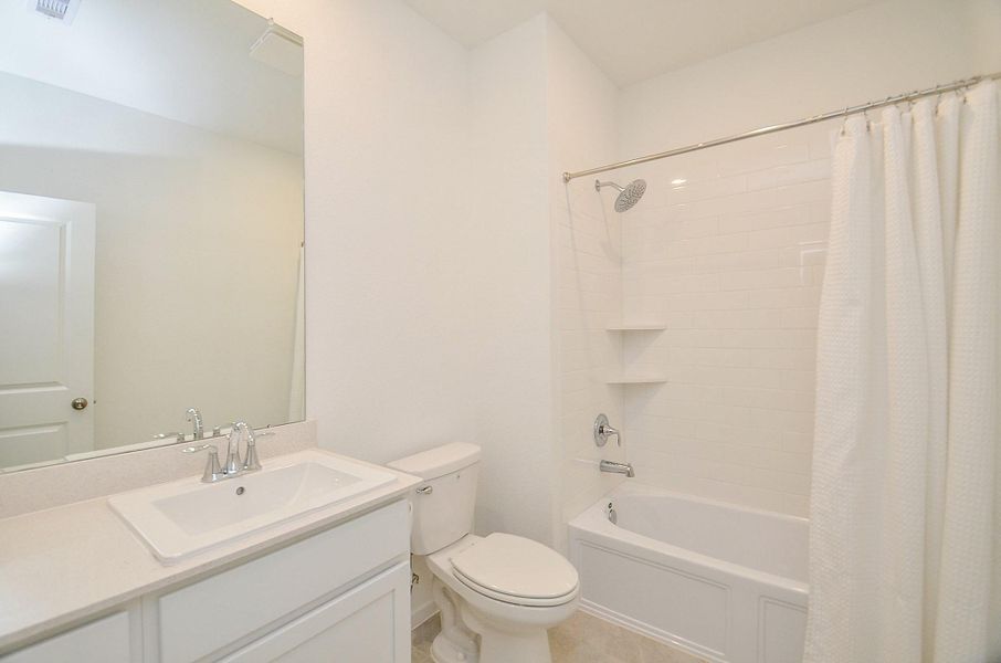 Hall bath between the two secondary bedrooms- tub/shower combination