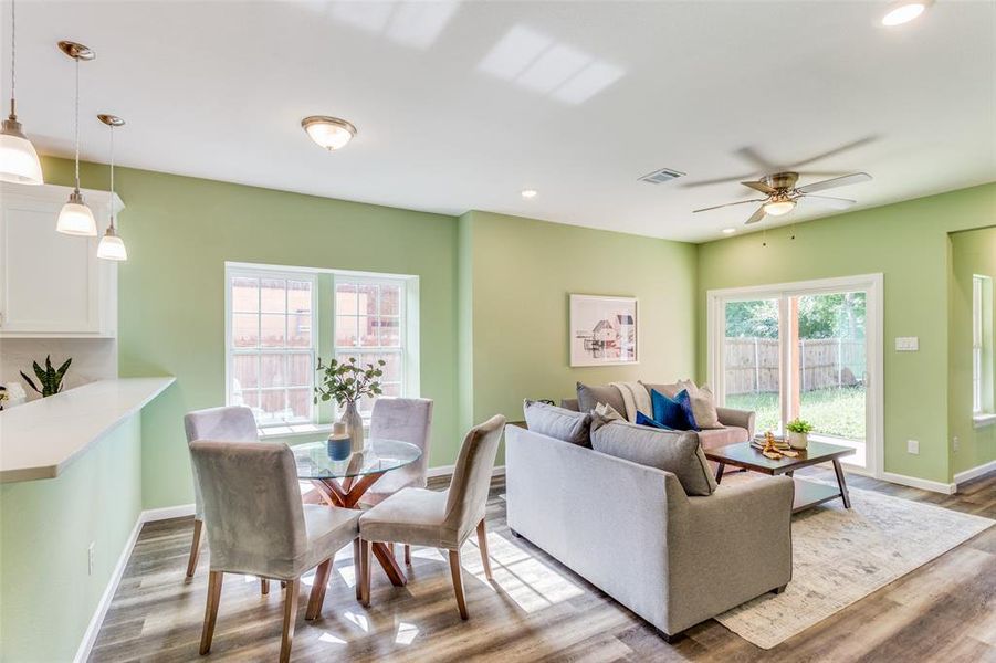 Living room featuring hardwood / wood-style flooring and ceiling fan