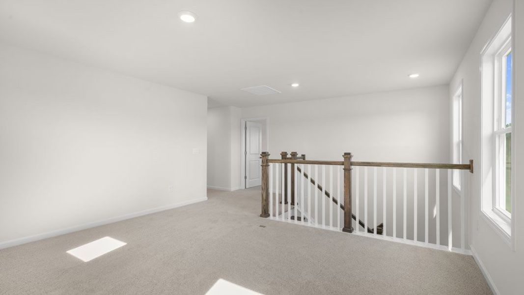 Representative unfurnished interior of a home built from the EDISTO by D.R. Horton in Eagle Creek, Fuquay Varina (Image 11).