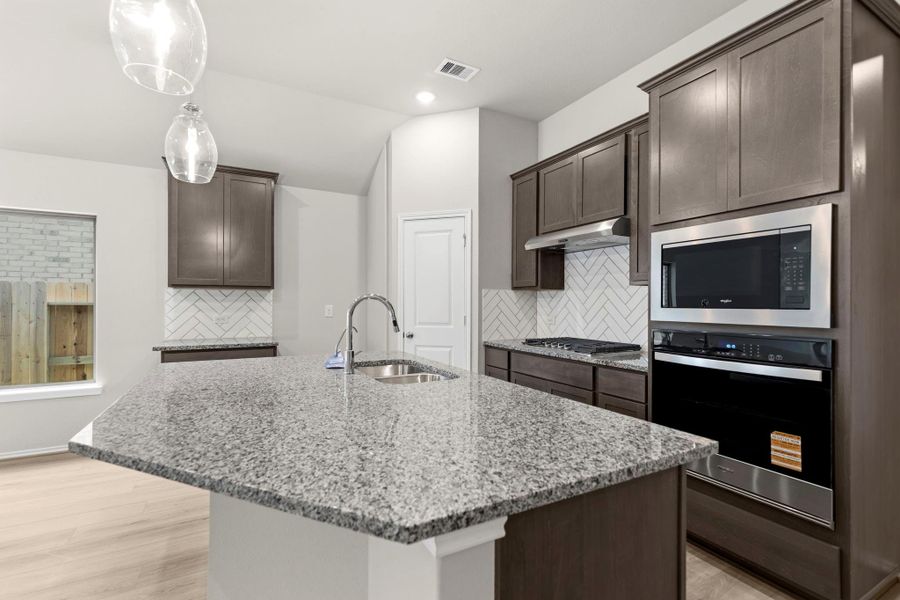 Furnished interior view inside a new home in Grand Central Park, Conroe (Image 13).