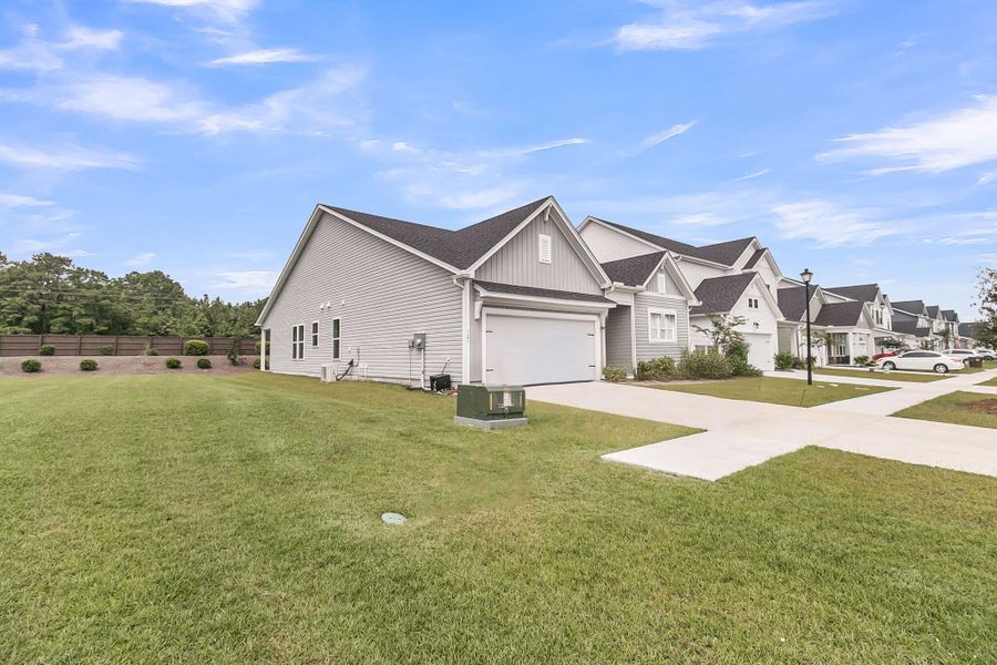 Front exterior of a new home in The Groves of Berkeley, Moncks Corner, SC, highlighting curb appeal (Image 2).