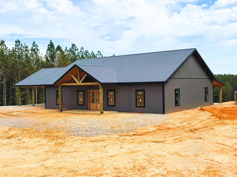 Front exterior of a new home in , Lenoir, NC, highlighting curb appeal (Image 3).