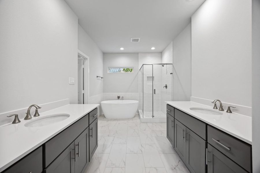 Morning routines just leveled up. Dual vanities, quartz counters, soft lighting—and enough space for two people to actually get ready in peace.