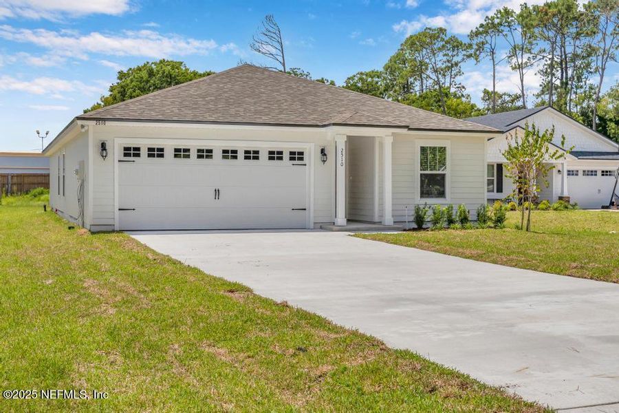 Front exterior of a new home in , Jacksonville, FL, highlighting curb appeal (Image 25).