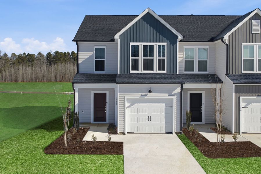 Front exterior of a new home in Poets Walk, Whitsett, NC, highlighting curb appeal (Image 31).