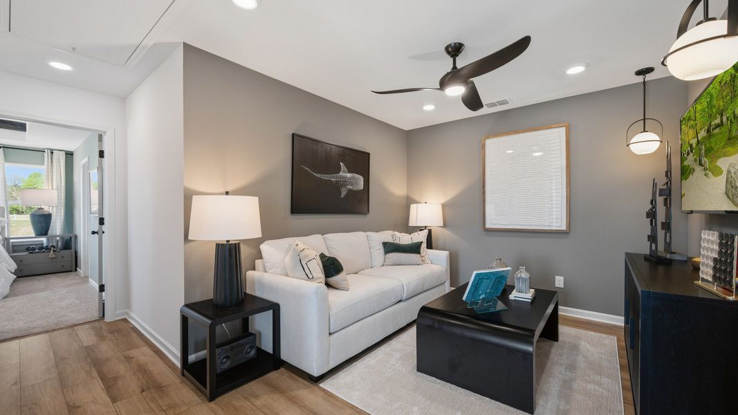 Inviting loft area with open layout and flexible living space in new construction townhome in Loganville, GA.