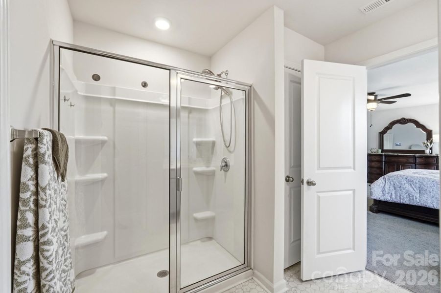 A spacious walk-in shower complements the relaxing primary bath. A spacious walk-in shower complements the relaxing primary bath.