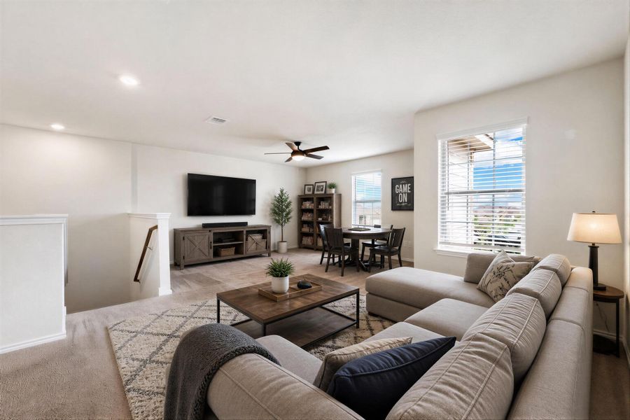 An inviting gathering space offers plush seating and ample room for relaxation and entertainment. Virtually Staged An inviting gathering space offers plush seating and ample room for relaxation and entertainment. Virtually Staged