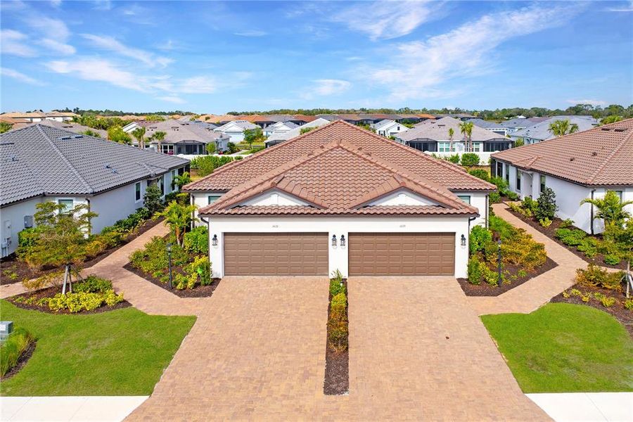 Front exterior of a new home in , Lakewood Ranch, FL, highlighting curb appeal (Image 21).