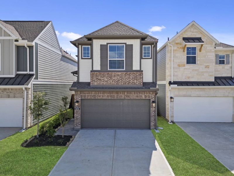 Front exterior of a new home in Bridgeland, Cypress, TX, highlighting curb appeal (Image 22). Front exterior of a new home in Bridgeland, Cypress, TX, highlighting curb appeal (Image 22).