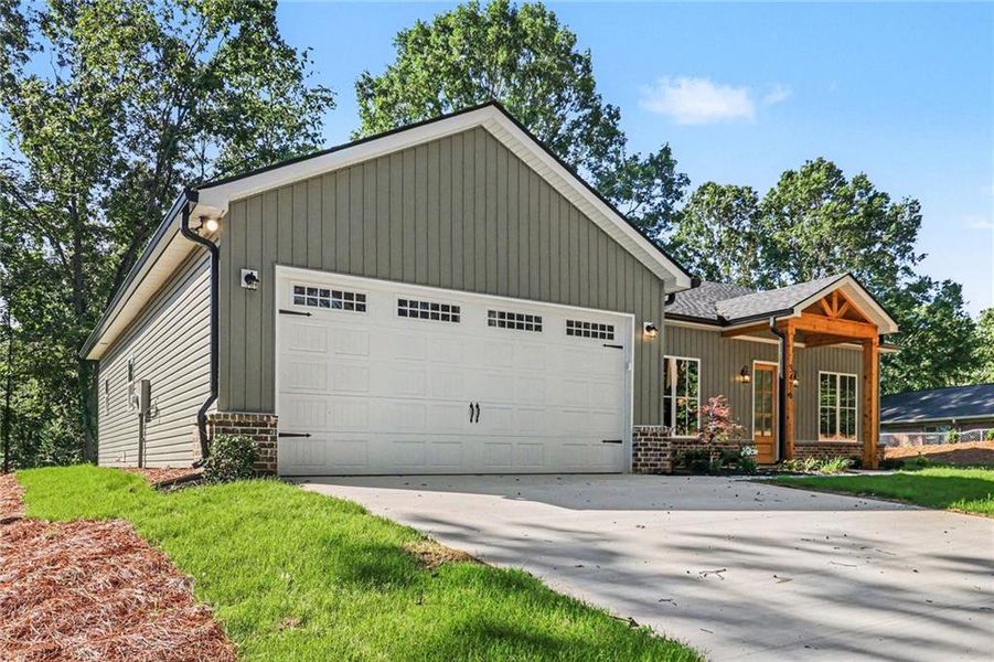 Front exterior of a new home in , Gainesville, GA, highlighting curb appeal (Image 17).