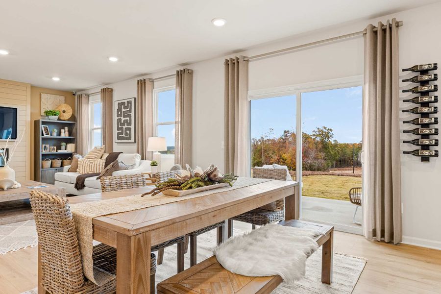 A living room with a large table.