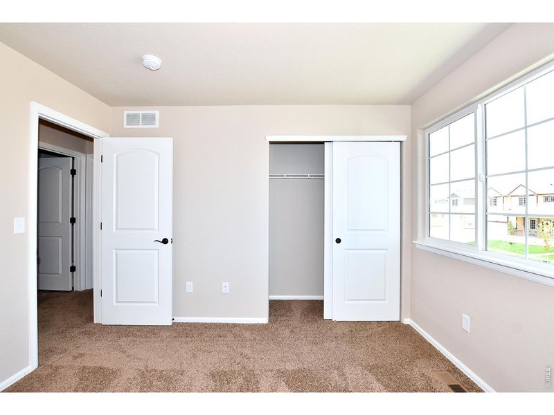 Spacious, unfurnished interior of a new home in Union Colony West, Greeley (Image 33).