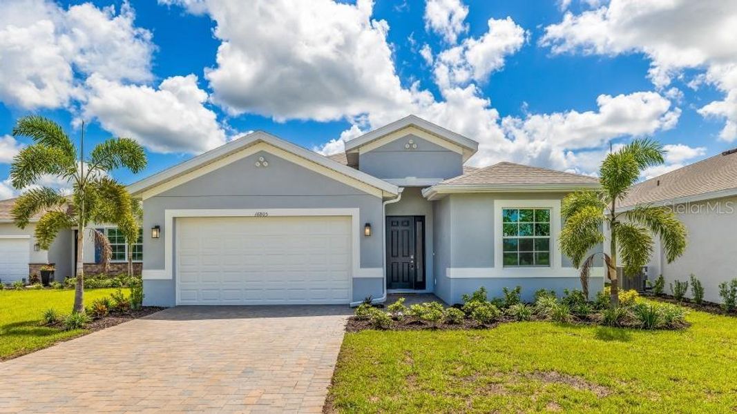 Front exterior of a new home in , Punta Gorda, FL, highlighting curb appeal (Image 1). Front exterior of a new home in , Punta Gorda, FL, highlighting curb appeal (Image 1).