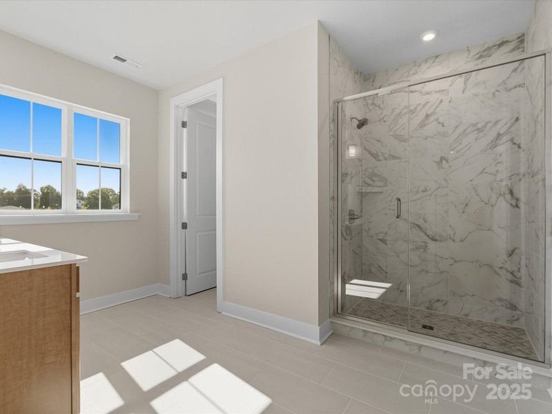 Spa-inspired en suite primary bath.
