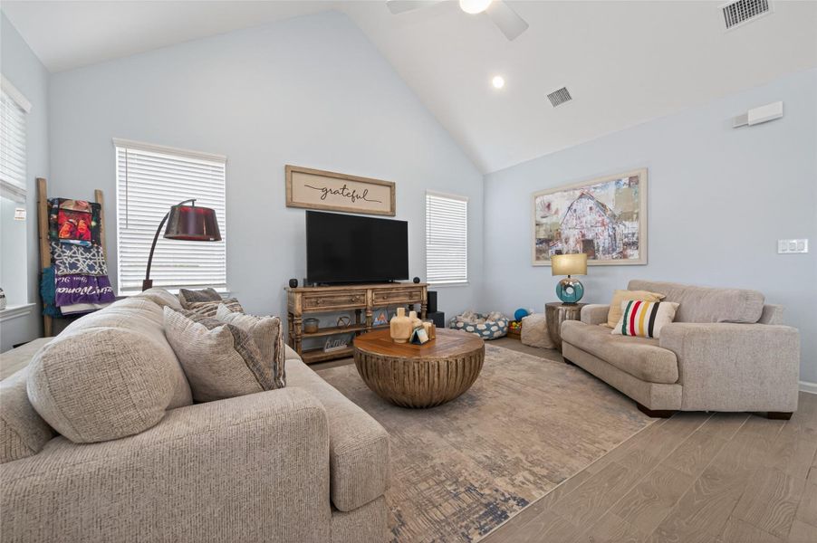 Inviting living area featuring soaring ceilings and an abundance of natural light