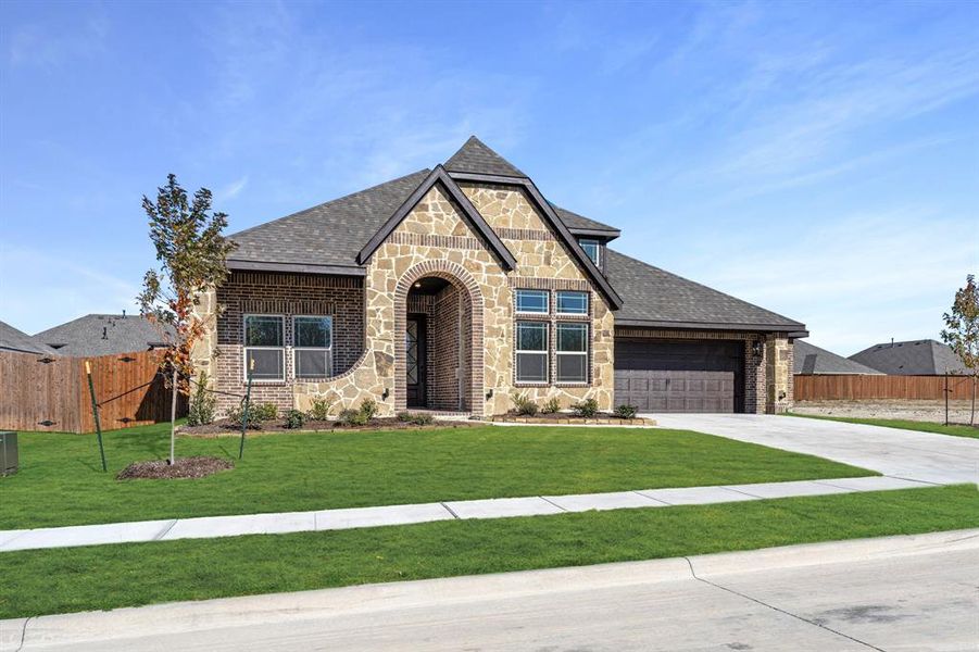 Front exterior of a new home in Maplewood, Glenn Heights, TX, highlighting curb appeal (Image 23).