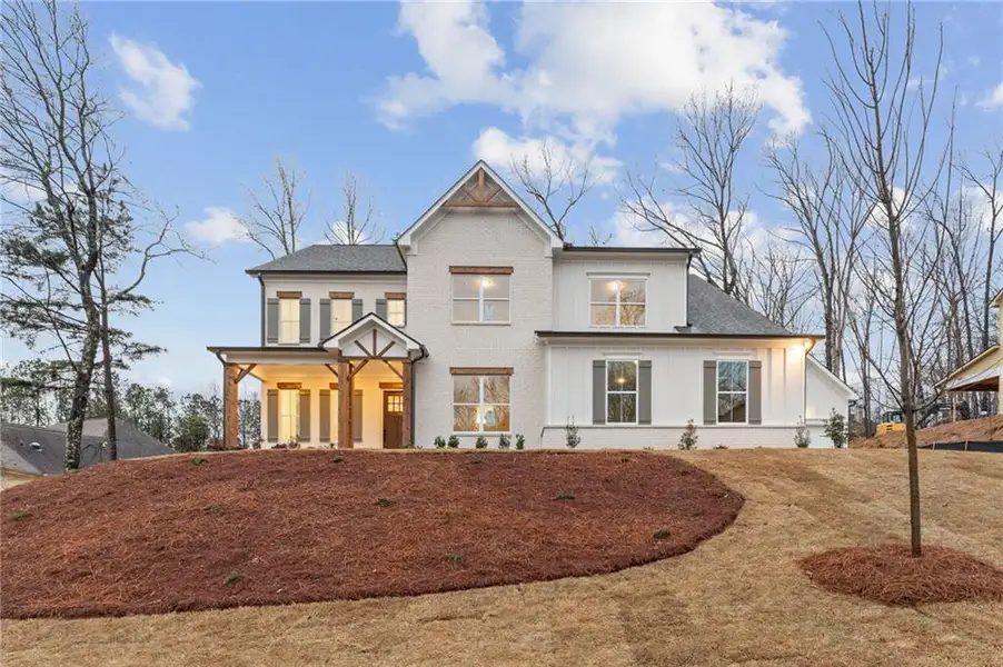 Front exterior of a new home in The Reserve at Knollwood, Canton, GA, highlighting curb appeal (Image 19).