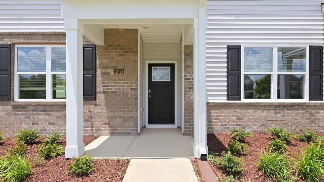 Exterior details and patio area of a home in Clock Road Townhomes, New Bern (Image 2). Exterior details and patio area of a home in Clock Road Townhomes, New Bern (Image 2).