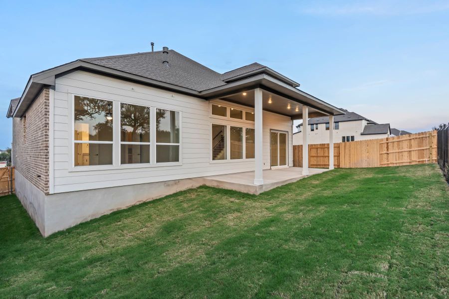 Exterior details and patio area of a home in Lariat, Liberty Hill (Image 29).